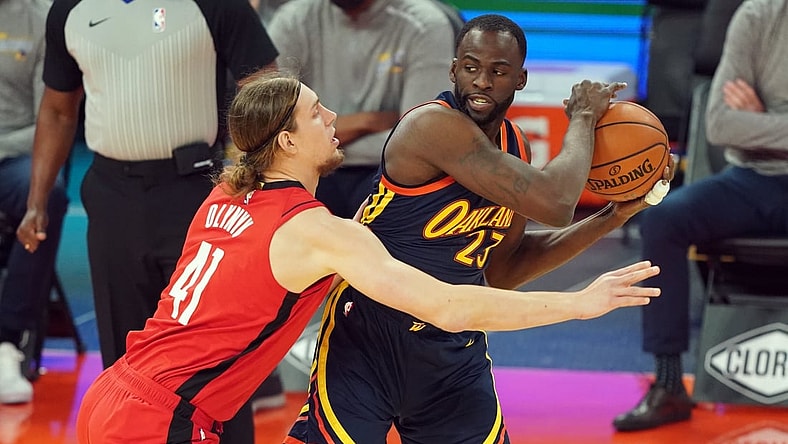 Apr 10, 2021; San Francisco, California, USA; Golden State Warriors forward Draymond Green (23) handles the ball while being defended by Houston Rockets forward Kelly Olynyk (41) during the first quarter at Chase Center. Mandatory Credit: Darren Yamashita-USA TODAY Sports
