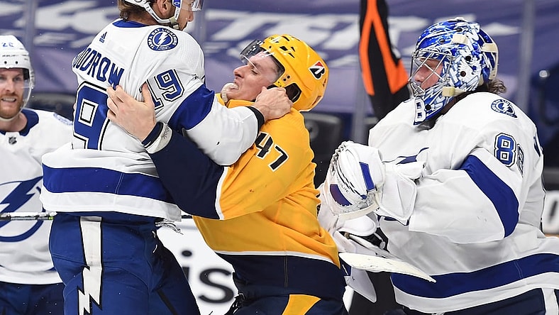 Apr 10, 2021; Nashville, Tennessee, USA; Tampa Bay Lightning right wing Barclay Goodrow (19) confronts Nashville Predators right wing Michael McCarron (47)  in the third period at Bridgestone Arena. Mandatory Credit: Christopher Hanewinckel-USA TODAY Sports
