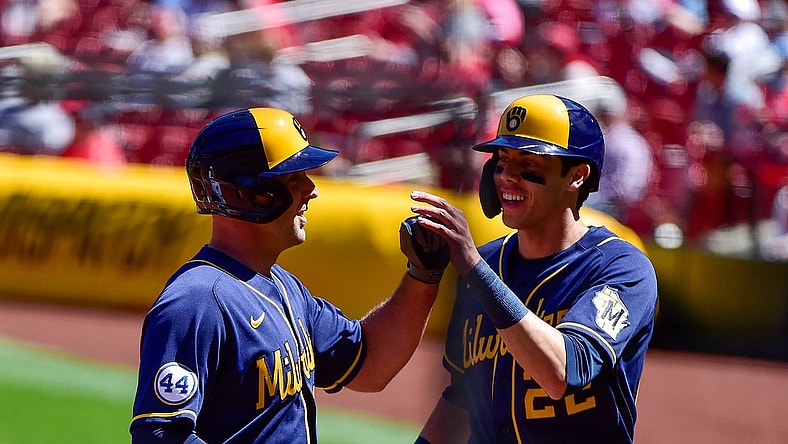 Apr 11, 2021; St. Louis, Missouri, USA;  Milwaukee Brewers third baseman Travis Shaw (21) celebrates with left fielder Christian Yelich (22) after hitting a three run home run off of St. Louis Cardinals starting pitcher Daniel Ponce de Leon (not pictured) during the second inning at Busch Stadium. Mandatory Credit: Jeff Curry-USA TODAY Sports