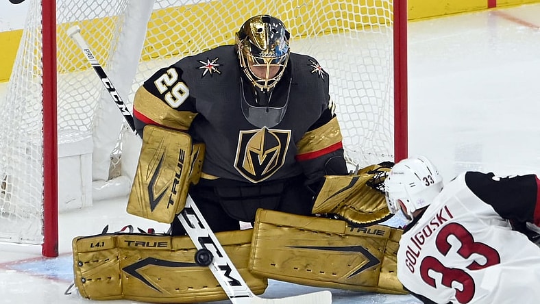 Apr 11, 2021; Las Vegas, NV, USA; Vegas Golden Knights goaltender Marc-Andre Fleury (29) blacks a shot by Arizona Coyotes defenseman Alex Goligoski (33) during the second period at T-Mobile Arena. (Mandatory Credit: David Beckeri-USA TODAY Sports via The Associated Press)