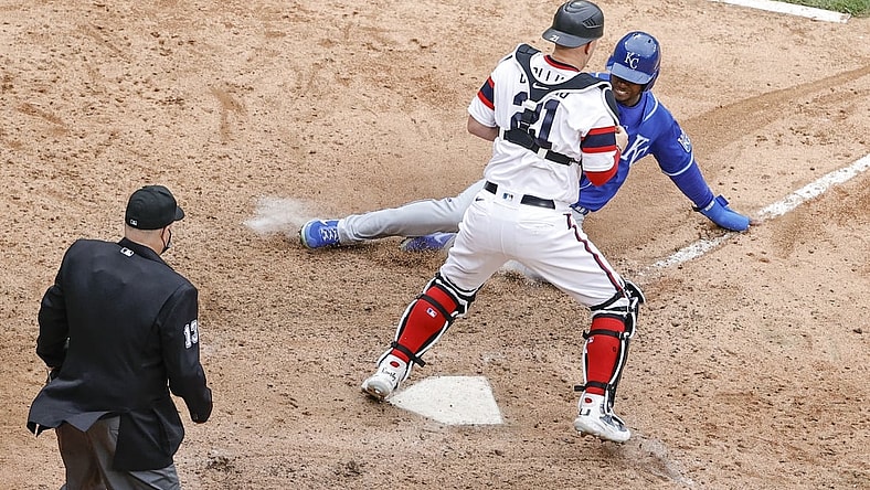 Apr 11, 2021; Chicago, Illinois, USA; Kansas City Royals center fielder Michael A. Taylor (2) scores as Chicago White Sox catcher Zack Collins (21) is unable to tag him out during the tenth inning at Guaranteed Rate Field. Mandatory Credit: Kamil Krzaczynski-USA TODAY Sports
