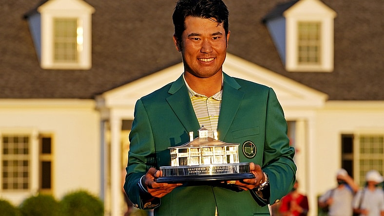 Apr 11, 2021; Augusta, Georgia, USA; Hideki Matsuyama celebrates with The Masters trophy after winning The Masters golf tournament. Mandatory Credit: Rob Schumacher-USA TODAY Sports
