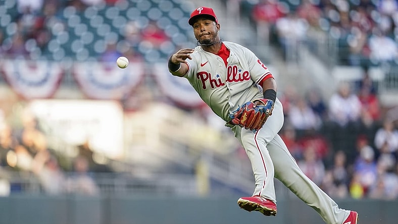 Apr 11, 2021; Cumberland, Georgia, USA; Philadelphia Phillies shortstop Jean Segura (2) throws to first base late on a single by Atlanta Braves third baseman Austin Riley (not pictured) during the first inning at Truist Park. Mandatory Credit: Dale Zanine-USA TODAY Sports