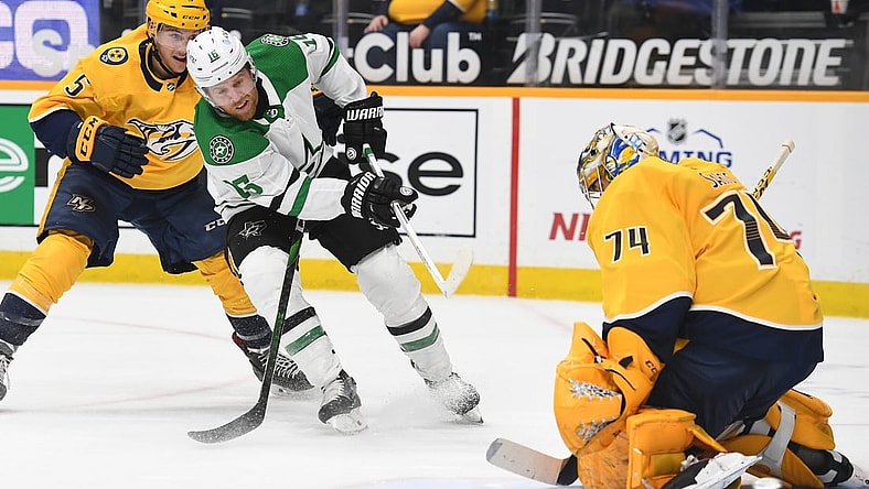 Apr 11, 2021; Nashville, Tennessee, USA; Dallas Stars center Joe Pavelski (16) has a shot blocked by Nashville Predators goaltender Juuse Saros (74) during the second period at Bridgestone Arena. Mandatory Credit: Christopher Hanewinckel-USA TODAY Sports