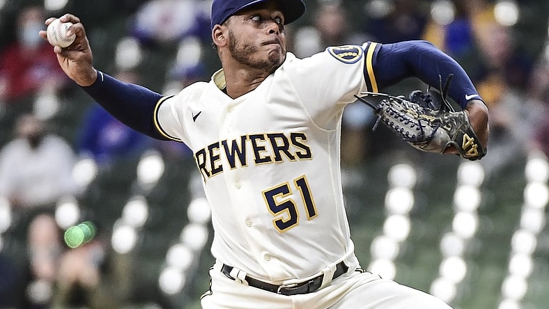 Apr 12, 2021; Milwaukee, Wisconsin, USA; Milwaukee Brewers pitcher Freddy Peralta (51) throws a pitch in the first inning against the Chicago Cubs at American Family Field. Mandatory Credit: Benny Sieu-USA TODAY Sports