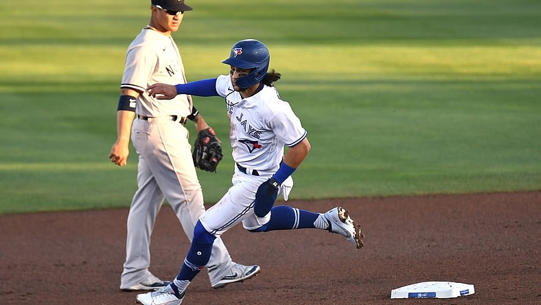 Apr 12, 2021; Dunedin, Florida, CAN; Toronto Blue Jays infielder Bo Bichette (11) heads for third base in the first inning against the New York Yankees at TD Ballpark. Mandatory Credit: Jonathan Dyer-USA TODAY Sports