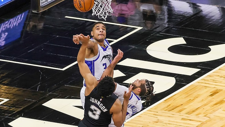 Apr 12, 2021; Orlando, Florida, USA; Orlando Magic forward Chuma Okeke (3) blocks a shot by San Antonio Spurs forward Keldon Johnson (3) as Orlando Magic guard Michael Carter-Williams (7) looks on during the first quarter at Amway Center. Mandatory Credit: Mike Watters-USA TODAY Sports