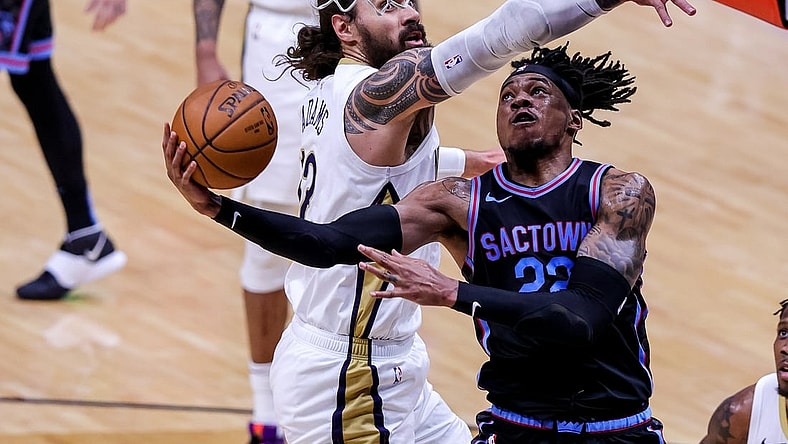 Apr 12, 2021; New Orleans, Louisiana, USA; New Orleans Pelicans center Steven Adams (12) defends the basket against Sacramento Kings center Richaun Holmes (22) during the first half at Smoothie King Center. Mandatory Credit: Stephen Lew-USA TODAY Sports