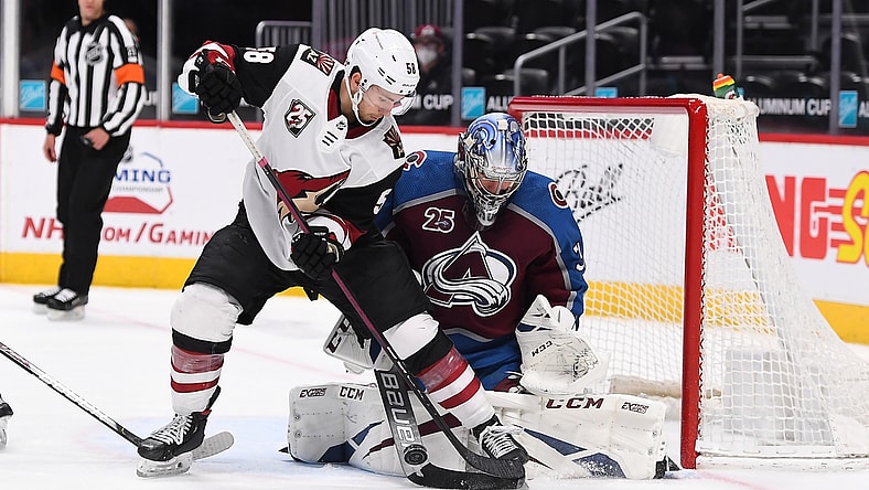 Apr 12, 2021; Denver, Colorado, USA; Arizona Coyotes left wing Michael Bunting (58) is unable to score against Colorado Avalanche goaltender Philipp Grubauer (31) in the third period at Ball Arena. Mandatory Credit: Ron Chenoy-USA TODAY Sports