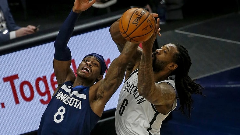 Apr 13, 2021; Minneapolis, Minnesota, USA; Minnesota Timberwolves forward Jarred Vanderbilt (8) competes with Brooklyn Nets forward Joe Harris (12) for the ball in the first half at Target Center. Mandatory Credit: Bruce Kluckhohn-USA TODAY Sports