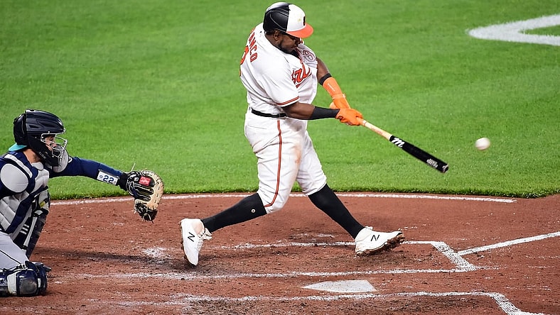 Apr 13, 2021; Baltimore, Maryland, USA; Baltimore Orioles third baseman Maikel Franco (3) hits a three run double in the third inning against the Seattle Mariners at Oriole Park at Camden Yards. Mandatory Credit: Evan Habeeb-USA TODAY Sports