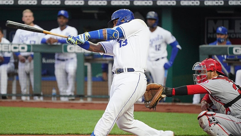 Apr 13, 2021; Kansas City, Missouri, USA; Kansas City Royals catcher Salvador Perez (13) hits a double during the first inning against the Los Angeles Angels at Kauffman Stadium. Mandatory Credit: Denny Medley-USA TODAY Sports