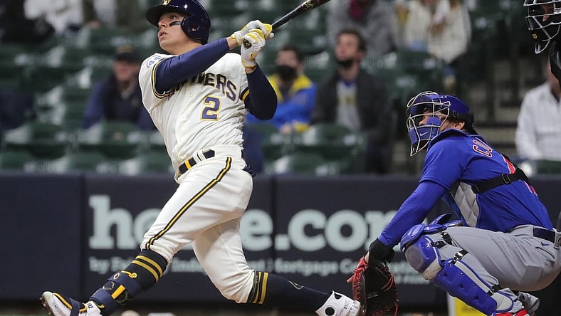 Apr 13, 2021; Milwaukee, Wisconsin, USA; Milwaukee Brewers third baseman Luis Urias (2) hits a two-run home run against the Chicago Cubs during the second inning at American Family Field. Mandatory Credit: Mark Hoffman/Milwaukee Journal Sentinel via USA TODAY NETWORK