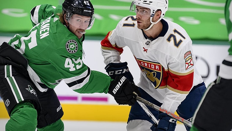 Apr 13, 2021; Dallas, Texas, USA; Dallas Stars defenseman Sami Vatanen (45) defends against Florida Panthers center Alex Wennberg (21) during the first period at the American Airlines Center. Mandatory Credit: Jerome Miron-USA TODAY Sports