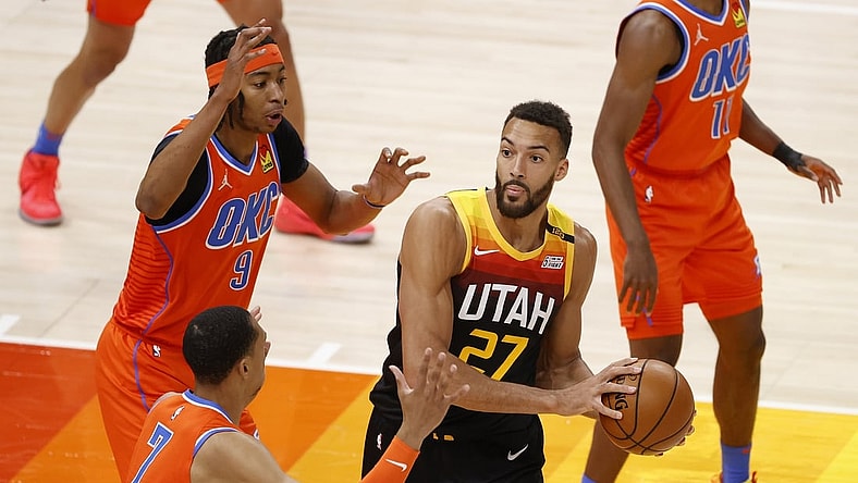 Apr 13, 2021; Salt Lake City, Utah, USA; Utah Jazz center Rudy Gobert (27) looks to pass against Oklahoma City Thunder forward Darius Bazley (7) and center Moses Brown (9) in the first quarter at Vivint Smart Home Arena. Mandatory Credit: Jeffrey Swinger-USA TODAY Sports