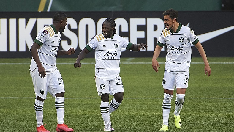 Apr 13, 2021; Portland, Oregon, USA; Portland Timbers forward Yimmi Chara (23) celebrates with teammates after scoring a goal during the second half against Marathon at Providence Park. Mandatory Credit: Troy Wayrynen-USA TODAY Sports