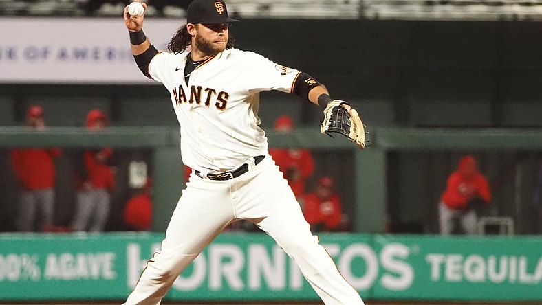 Apr 13, 2021; San Francisco, California, USA; San Francisco Giants shortstop Brandon Crawford (35) throws to first base against the Cincinnati Reds during the fifth inning at Oracle Park. Mandatory Credit: Kelley L Cox-USA TODAY Sports