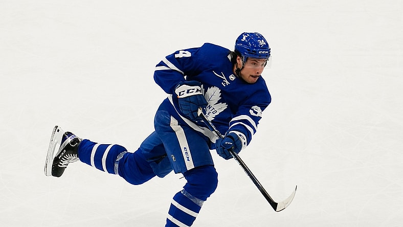 Apr 7, 2021; Toronto, Ontario, CAN; Toronto Maple Leafs forward Auston Matthews (34) shoots the puck against the Montreal Canadiens during the first period at Scotiabank Arena. Mandatory Credit: John E. Sokolowski-USA TODAY Sports