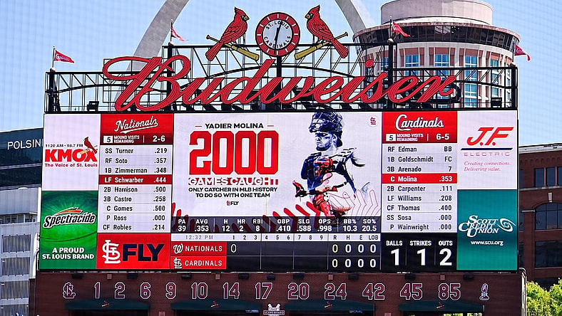 Apr 14, 2021; St. Louis, Missouri, USA;  The St. Louis Cardinals salute catcher Yadier Molina (4) for starting his 2,000 game as catcher for one organization during the first inning against the Washington Nationals at Busch Stadium. Mandatory Credit: Jeff Curry-USA TODAY Sports