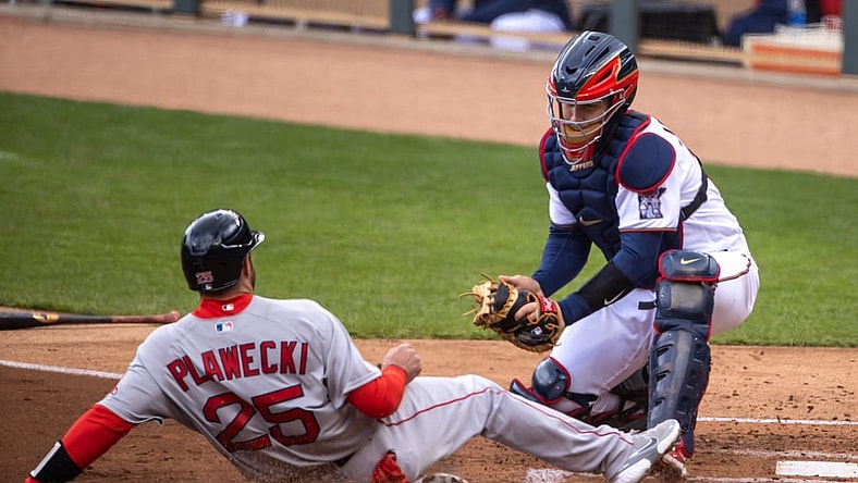 Apr 14, 2021; Minneapolis, Minnesota, USA; Boston Red Sox catcher Kevin Plawecki (25) gets tagged out at home plate from Minnesota Twins catcher Ryan Jeffers (27) in the second inning at Target Field. Mandatory Credit: Jesse Johnson-USA TODAY Sports