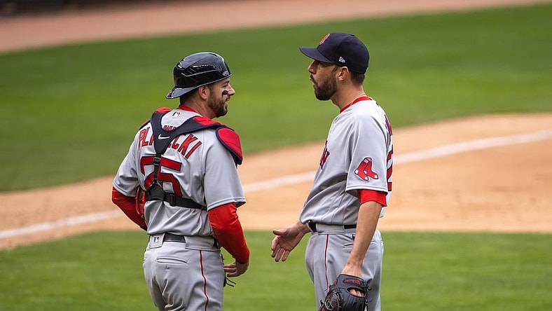 Apr 14, 2021; Minneapolis, Minnesota, USA; Boston Red Sox relief pitcher Matt Barnes (32) and catcher Kevin Plawecki (25) celebrate after defeating the Minnesota Twins at Target Field. Mandatory Credit: Jesse Johnson-USA TODAY Sports