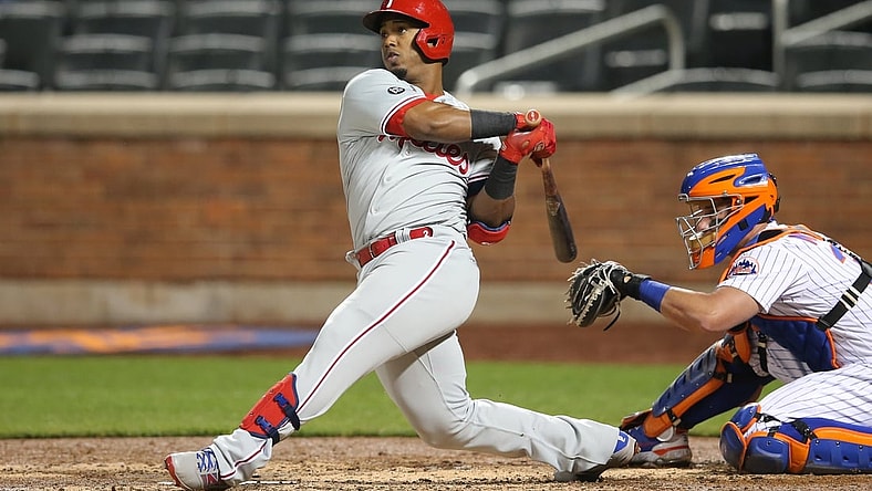 Apr 14, 2021; New York City, New York, USA; Philadelphia Phillies second baseman Jean Segura (2) follows through on a solo home run against the New York Mets during the fifth inning at Citi Field. Mandatory Credit: Brad Penner-USA TODAY Sports