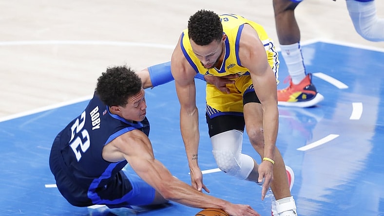 Apr 14, 2021; Oklahoma City, Oklahoma, USA; Oklahoma City Thunder center Isaiah Roby (22) and Golden State Warriors guard Stephen Curry (30) battle for a loose ball during the first quarter at Chesapeake Energy Arena. Mandatory Credit: Alonzo Adams-USA TODAY Sports