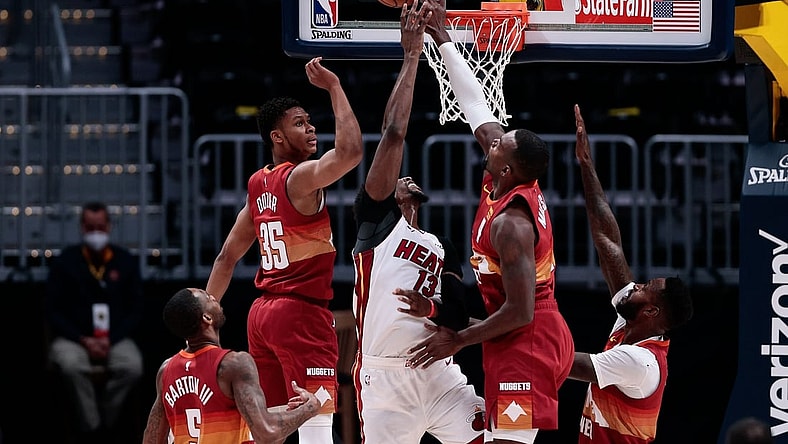 Apr 14, 2021; Denver, Colorado, USA; Denver Nuggets forward Paul Millsap (4) blocks the shot of Miami Heat center Bam Adebayo (13) as guard PJ Dozier (35) and forward Will Barton (5) forward JaMychal Green (0) defend in the second quarter at Ball Arena. Mandatory Credit: Isaiah J. Downing-USA TODAY Sports