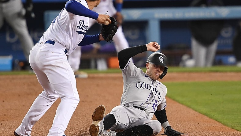 Apr 14, 2021; Los Angeles, California, USA;   Colorado Rockies shortstop Trevor Story (27) is out at second but Los Angeles Dodgers shortstop Corey Seager (5) is not able to complete the double play in the fifth inning of the game at Dodger Stadium. Mandatory Credit: Jayne Kamin-Oncea-USA TODAY Sports