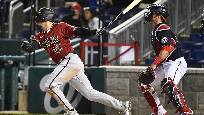 Apr 15, 2021; Washington, District of Columbia, USA; Arizona Diamondbacks second baseman Andrew Young hits a grand slam against the Washington Nationals during the second inning at Nationals Park. Mandatory Credit: Brad Mills-USA TODAY Sports