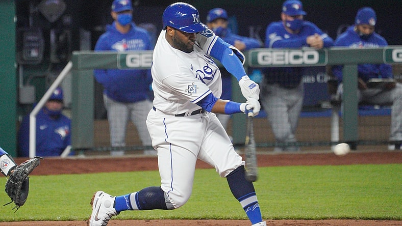 Apr 15, 2021; Kansas City, Missouri, USA; Kansas City Royals third baseman Hanser Alberto hits a two-run double in the fourth inning against the Toronto Blue Jays at Kauffman Stadium. Mandatory Credit: Denny Medley-USA TODAY Sports