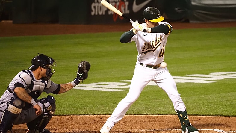 Apr 15, 2021; Oakland, California, USA; Oakland Athletics right fielder Mark Canha avoids the ball to earn a walk against the Detroit Tigers during the fourth inning at RingCentral Coliseum. Mandatory Credit: Kelley L Cox-USA TODAY Sports