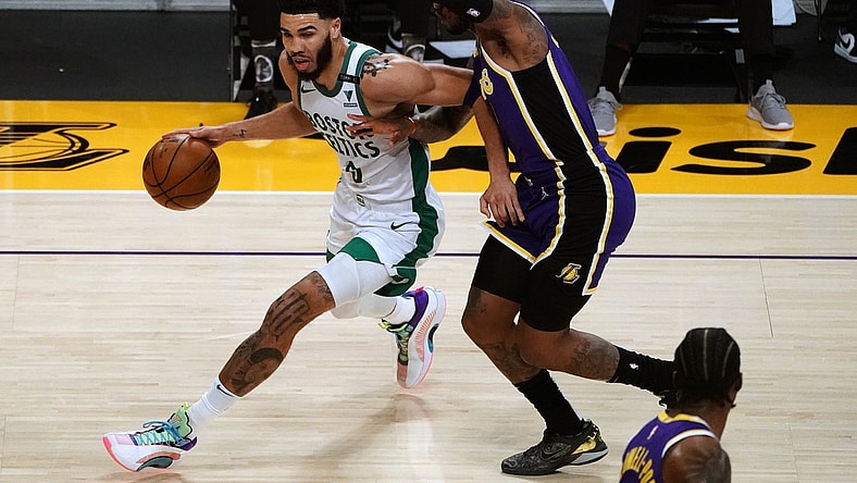 Apr 15, 2021; Los Angeles, California, USA; Boston Celtics forward Jayson Tatum (0) moves to the basket against Los Angeles Lakers guard Ben McLemore (7) during the first half at Staples Center. Mandatory Credit: Gary A. Vasquez-USA TODAY Sports