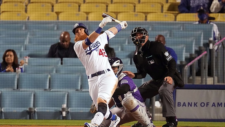 Apr 15, 2021; Los Angeles, California, USA; Los Angeles Dodgers third baseman Justin Turner follows through on a three-run home run in the third inning against the Colorado Rockies at Dodger Stadium. Mandatory Credit: Kirby Lee-USA TODAY Sports