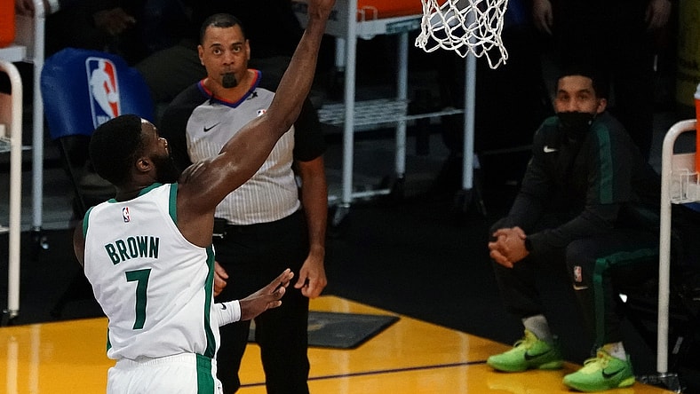 Apr 15, 2021; Los Angeles, California, USA; Boston Celtics guard Jaylen Brown (7) moves in for a basket against the Los Angeles Lakers during the second half at Staples Center. Mandatory Credit: Gary A. Vasquez-USA TODAY Sports