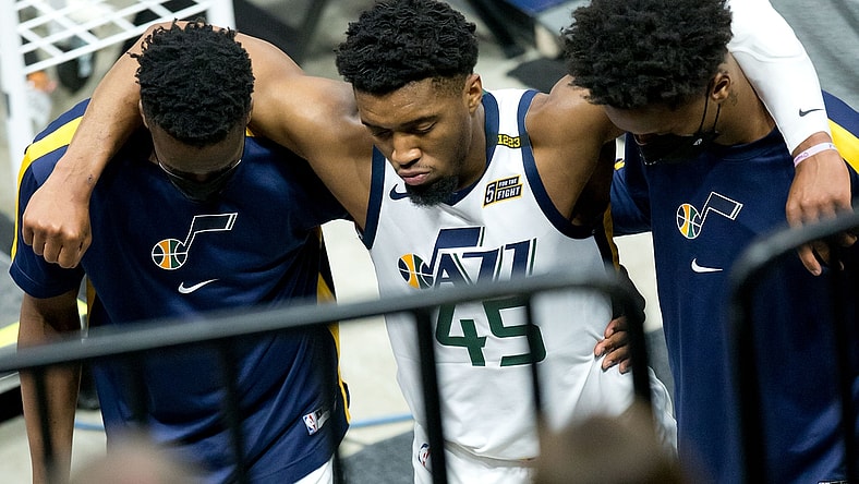 Apr 16, 2021; Salt Lake City, Utah, USA; Utah Jazz guard Donovan Mitchell (45) is helped off the court after suffering an apparent injury during the second half against the Indiana Pacers at Vivint Smart Home Arena. Mandatory Credit: Russell Isabella-USA TODAY Sports