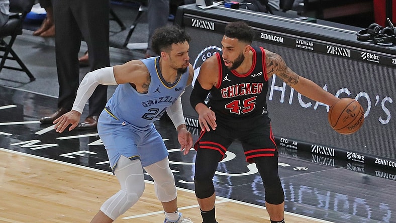 Apr 16, 2021; Chicago, Illinois, USA; Chicago Bulls guard Denzel Valentine (45) is defended by Memphis Grizzlies forward Dillon Brooks (24) during the second quarter at the United Center. Mandatory Credit: Dennis Wierzbicki-USA TODAY Sports