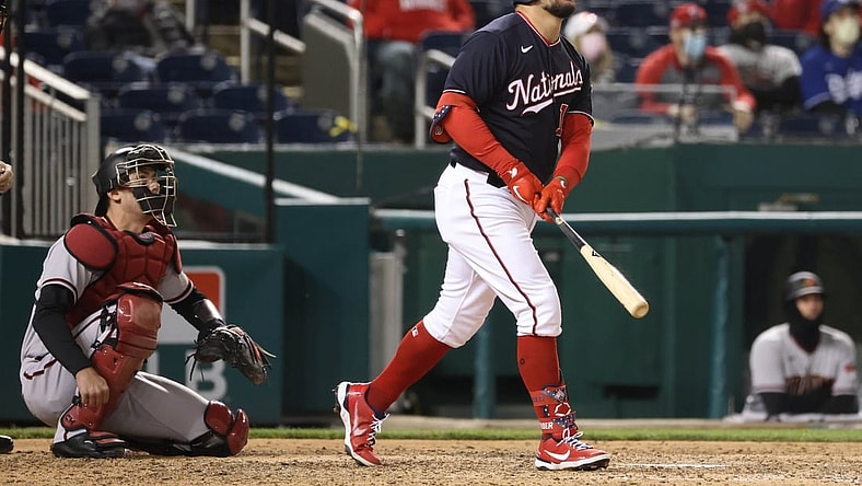 Apr 16, 2021; Washington, District of Columbia, USA; Washington Nationals left fielder Kyle Schwarber (12) hits a walk-off home run against the Arizona Diamondbacks in the ninth inning at Nationals Park. Mandatory Credit: Geoff Burke-USA TODAY Sports