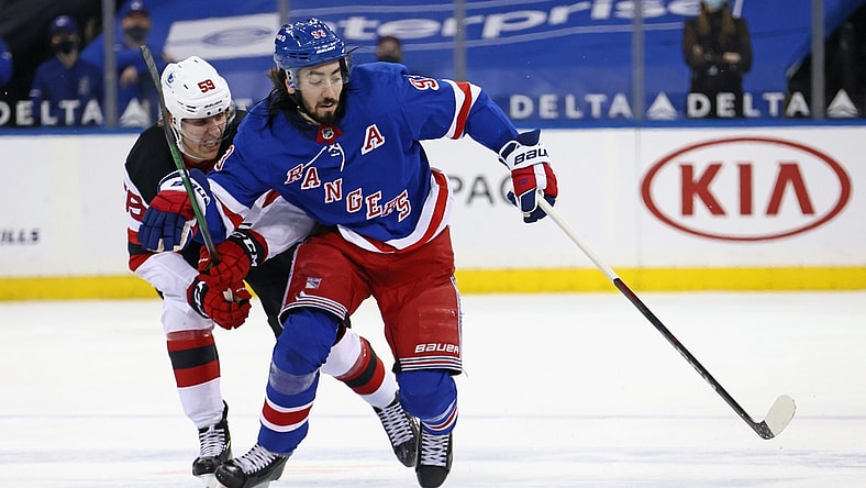Apr 17, 2021; New York, New York, USA; anne Kuokkanen #59 of the New Jersey Devils holds back Mika Zibanejad #93 of the New York Rangers during the second period at Madison Square Garden. Mandatory Credit:  POOL PHOTOS-USA TODAY Sports
