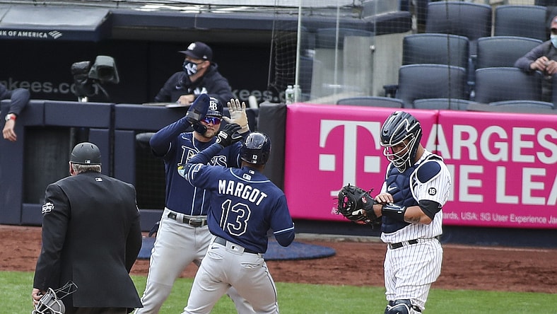 Apr 17, 2021; Bronx, New York, USA; Tampa Bay Rays left fielder Manuel Margot (13) is greeted at home plate by designated hitter Austin Meadows (17) after hitting a two run home run in the fourth inning against the New York Yankees at Yankee Stadium. Mandatory Credit: Wendell Cruz-USA TODAY Sports