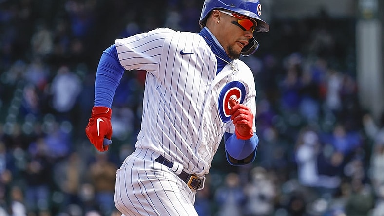 Apr 17, 2021; Chicago, Illinois, USA; Chicago Cubs shortstop Javier Baez (9) rounds the bases after hitting a three-run home run against the Atlanta Braves during the third inning at Wrigley Field. Mandatory Credit: Kamil Krzaczynski-USA TODAY Sports