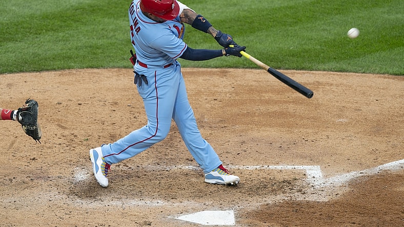 Apr 17, 2021; Philadelphia, Pennsylvania, USA; St. Louis Cardinals catcher Yadier Molina (4) hits a home run during the fourth inning against the Philadelphia Phillies at Citizens Bank Park. Mandatory Credit: Gregory Fisher-USA TODAY Sports