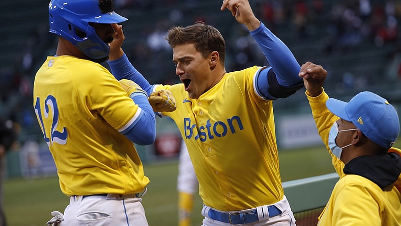 Apr 17, 2021; Boston, Massachusetts, USA; Boston Red Sox third baseman Marwin Gonzalez (12) is greeted by second baseman Enrique Hernandez (5) (center) after his home run against the Chicago White Sox as manager Alex Cora (20) looks on during the eighth inning at Fenway Park. Mandatory Credit: Winslow Townson-USA TODAY Sports