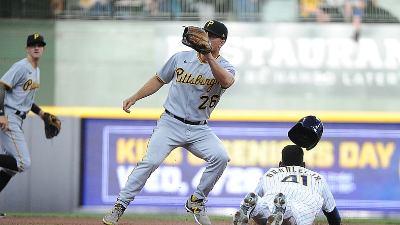 Apr 17, 2021; Milwaukee, Wisconsin, USA; Milwaukee Brewers center fielder Jackie Bradley Jr. (41) slides safely into second base ahead of the tag by Pittsburgh Pirates second baseman Adam Frazier (26) in the first inning at American Family Field. Mandatory Credit: Michael McLoone-USA TODAY Sports