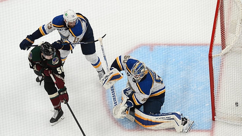 Apr 17, 2021; Glendale, Arizona, USA; Arizona Coyotes left wing Michael Bunting (58) deflects a shot by St. Louis Blues goaltender Jordan Binnington (50) for a goal during the third period at Gila River Arena. Mandatory Credit: Joe Camporeale-USA TODAY Sports