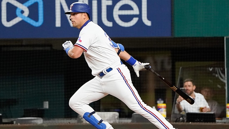 Apr 17, 2021; Arlington, Texas, USA; Texas Rangers first baseman Nate Lowe (30) runs to first base on his single against the Baltimore Orioles at Globe Life Field. Mandatory Credit: Jim Cowsert-USA TODAY Sports