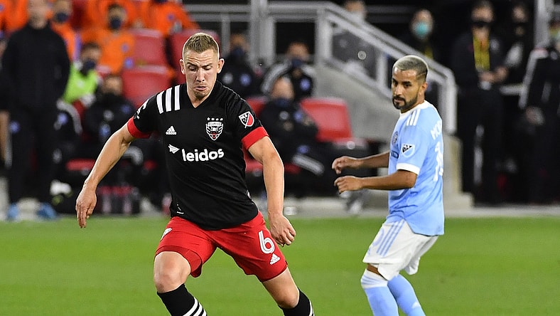 Apr 17, 2021; Washington, DC, Washington, DC, USA; D.C. United midfielder Russell Canouse (6) advances the ball as New York City FC midfielder Valentin Castellanos (11) looks on during the first half at Audi Field. Mandatory Credit: Brad Mills-USA TODAY Sports