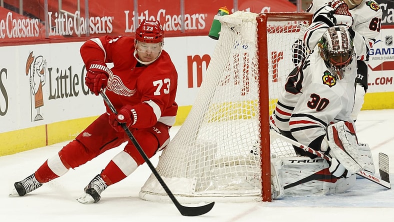Apr 17, 2021; Detroit, Michigan, USA; Detroit Red Wings left wing Adam Erne (73) skates with the puck around the goal of Chicago Blackhawks goaltender Malcolm Subban (30) in the second period at Little Caesars Arena. Mandatory Credit: Rick Osentoski-USA TODAY Sports
