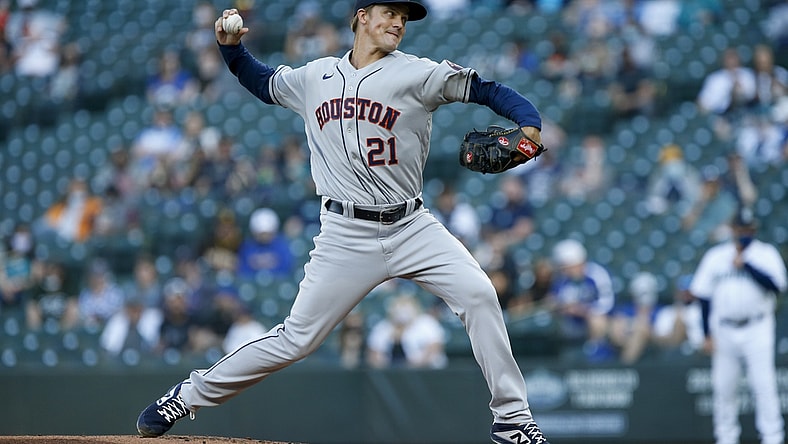 Apr 17, 2021; Seattle, Washington, USA; Houston Astros starting pitcher Zack Greinke (21) throws against the Seattle Mariners during the first inning at T-Mobile Park. Mandatory Credit: Joe Nicholson-USA TODAY Sports