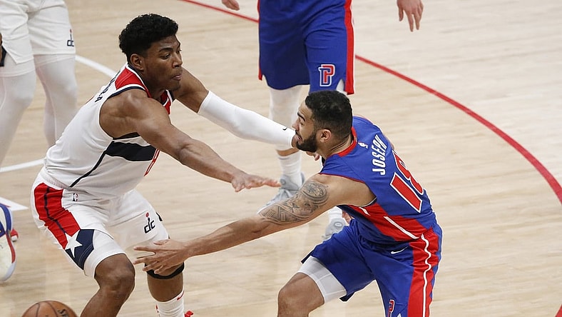 Apr 17, 2021; Washington, District of Columbia, USA; Detroit Pistons guard Cory Joseph (18) passes the ball around Washington Wizards forward Rui Hachimura (8) during the second half at Capital One Arena. Mandatory Credit: Amber Searls-USA TODAY Sports